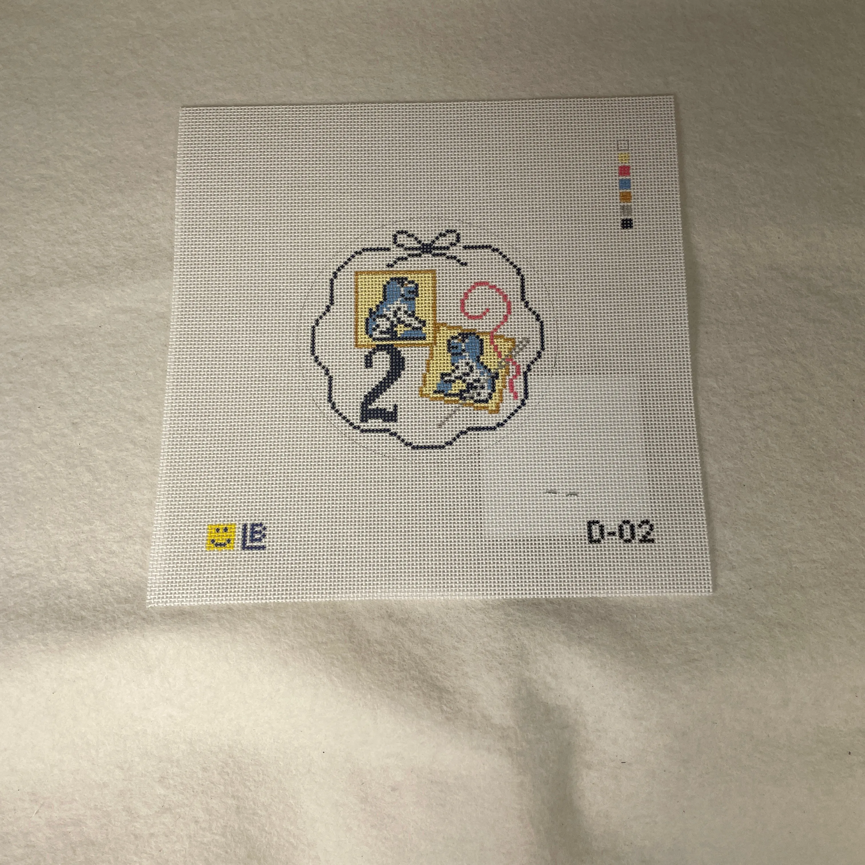 * Lauren Bloch  D02- 12 Days of Needlepoint- Two Foo Dog Needle Minders