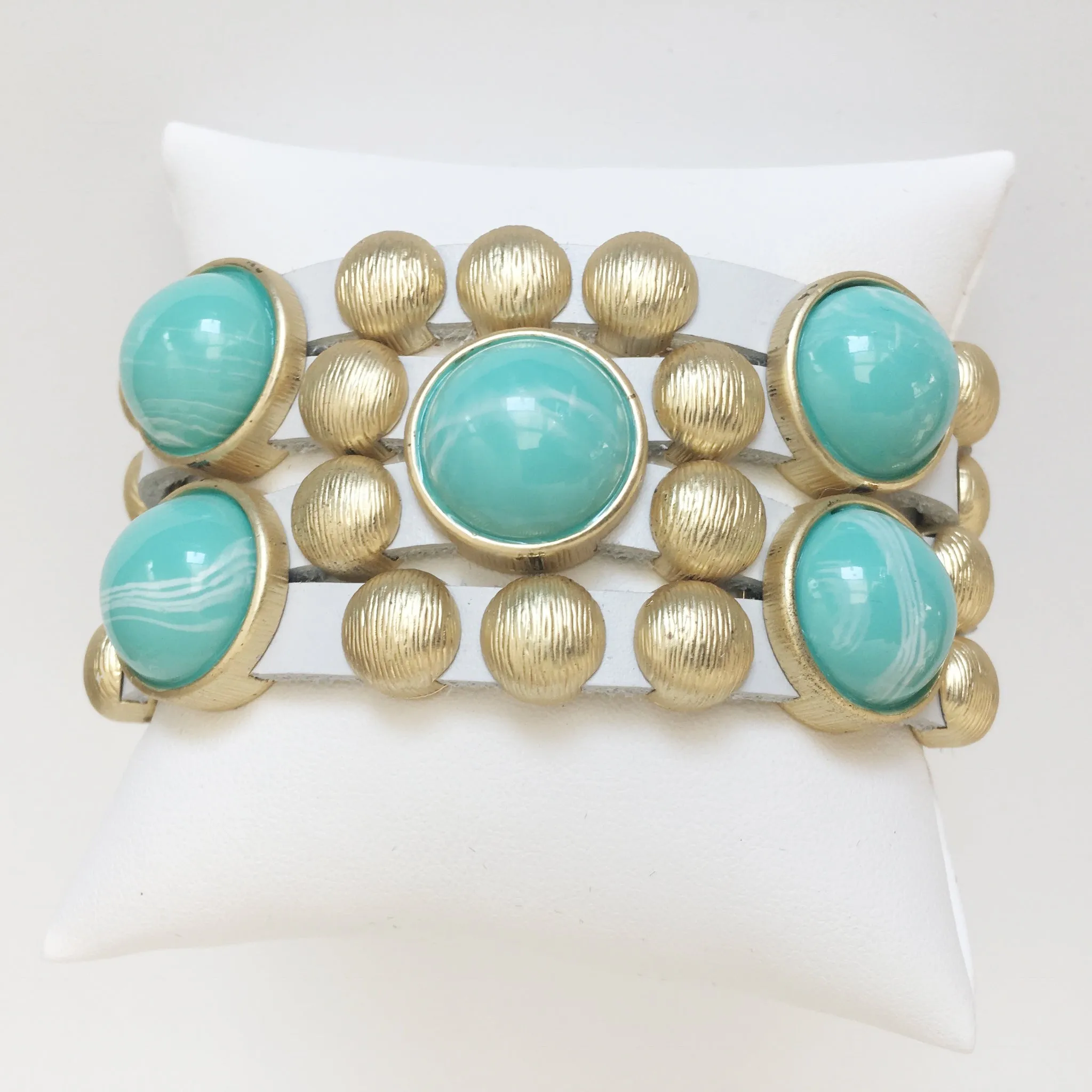 Bursting Goldtone Beads and Turquoise Resin Accents Adorn this White Leather Bracelet with Magnetic Clasp